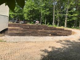 Railroad ties can be used in combination with some other popular outdoor decorative items to give your yard some more character and flavor. Railroad Tie Wall And Circle Landscapes Complete Llc Facebook