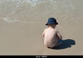 Germany, Amrum, Naked boy playing on beach Stock Photo - Alamy