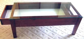 Bring the adventurous spirit of the outdoors into your living room with a boat coffee table. Glass Top Coffee Table With Display Drawer Home Design Ideas Display Coffee Table Coffee Table Coffee Table Display Case