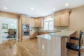 Kitchen with oak wood cabinetry. Help With Kitchen Cabinets Wall Paint Options With Honey Oak Floors