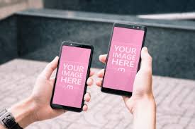 Make A Comparison With This Mockup Template Of A Man Holding 2 Android Devices In Hand On The Street Place Your Design Onto Phone Mockup Iphone Mockup Mockup