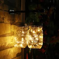 30 Ways To Use Outside Christmas Lights To Deck Your Halls This Holiday Season Mason Jar Lighting Mason Jar Fairy Lights Solar Mason Jars
