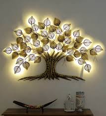 Therefore a great decorative option if you have a drab wall needing both color and texture. Buy Wrought Iron Decorative Tree In Golden With Led Wall Art By Sugandha Online Floral Metal Art Metal Wall Art Home Decor Pepperfry Product