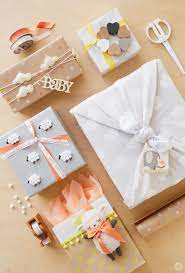 Unique baby shower gift ideas and clever gift wrapping inspiration. Baby Gift Wrap Ideas Showered With Love Think Make Share Baby Gift Wrapping Gift Wrapping Baby Shower Wrapping