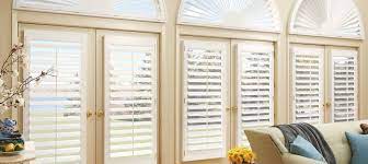Plantation shutters in master bedroom notice how our door shutter curves at the front, avoiding the box effect custom silk panels with soft cornice underneath custom swag and cascade in a gorgeous cinnamon damask diamond swag holders in a walnut finish highlight the arch panels on round. Hunter Douglas Hybrid Shutters Zblinds Fresno