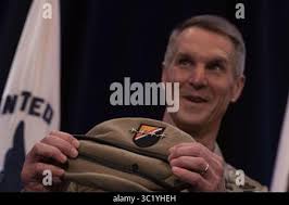 Army Gen. Richard D. Clarke, commander, U.S. Special Operations Command,  and Air Force Command Chief Master Sgt. Gregory A. Smith, USSOCOM senior  enlisted leader, lay a wreath during a Memorial Day observation