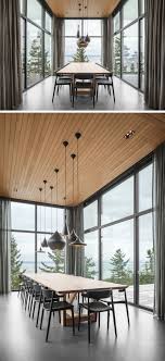 A Dining Room Surrounded By Glass Is Projected Out From The Rest Of This House Minimalist Dining Room Modern Dining Room Dining Room Design