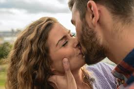 30s man and woman kissing on the riverside on sunrise. Man And Woman Kiss Each Other Free Stock Photo