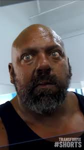 Guy Eating Eggs and Then Flexing Muscles