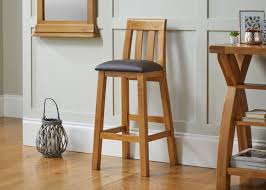 Each modern piece features a sleek pedestal base and a thin frame made from iron and steel with a shiny chrome. Billy Tall Solid Oak Bar Stool Brown Leather Free Delivery Top Furniture