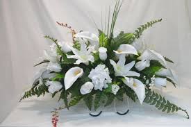 Providing you with only the best arrangements for your loved ones we offer a personal touch that only a family company, dedicated to artificial graveside tributes, can bring. No 50066 White Lily Cemetery Flower Arrangement Headstone Saddle Grave Tombstone Arran Cemetery Flowers Funeral Flower Arrangements Flower Arrangements