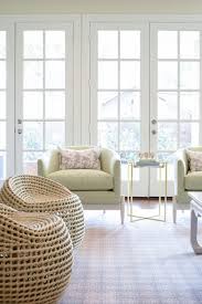 Living Room Design With Leather Swivel Stools And Green Accent Chairs Brass And Marb Comfortable Living Room Chairs Side Chairs Living Room Living Room Decor