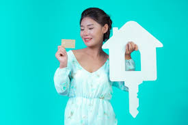Download free floral card vectors and other types of floral card graphics and clipart at freevector.com! The Girl Wore A White Long Sleeved Shirt With Floral Pattern Holding A White House Symbol And A Gold Credit Card With A Blue Free Picture On Freepik