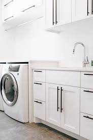 For example, the stark contrast between antique white shaker kitchen cabinets. Modern Laundry Alpine Cabinetry Alpine Cabinetry