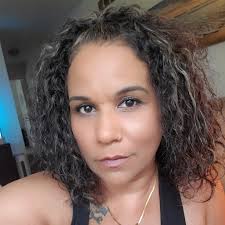 My recently adopted rescue Tortie is smoochy usually when I get home from  work (likely due to her missing me) but when I pick her up for some  cuddles, she never likes