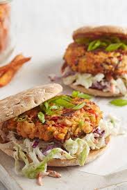 Salmon Burgers On Toasted Rolls Are Served With Tasty Coleslaw And Roasted Carrots For A Budget Friendly Meal With Pl Clean Eating Recipes Food Seafood Recipes