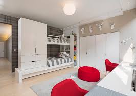 A crib in a streamlined silhouette gives baby a comfortable spot to sleep, while a coordinating dresser contains their clothing and extra bedding. 16 Minimalist Modern Kids Room Designs That Are Anything But Bare