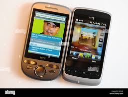 An HTC Tattoo mobile phone and a HTC ...
