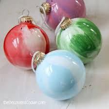 Paint Swirl Ornaments Are A Kid Friendly Christmas Craft Kids Christmas Ornaments Ornaments Diy Kids Painted Christmas Ornaments