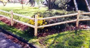 Rather than just hanging flower or plant pots at the tops of fence posts, installing pot brackets below the tops of the fence provides ample room to grow without blocking the tapered posts at the top of a fence. 2 Rail Round Rail Post And Rail Fence Fence Design Post And Rail Fence Garden Yard Ideas