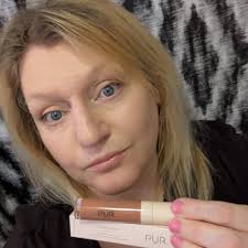 The PUR Glossy Lip Tint Plumping Tinted Lip Oil in Blackberry Smash. Plumps  and soothes lips in one swipe. Gives me a glossy tint with one swipe of the  applicator. Feels comfortable