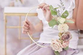 Decorate it with greenery and flowers for a romantic bridal shower centerpiece idea. Hoop Bouquet Flower Centerpieces Wedding Flower Girl Bouquet Blush Wedding Flowers