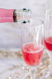 We sipped on champagne with candy cane stir sticks and everyone was hooked on the flavor combination. Alcoholic Drinks Best Christmas Mimosa Recipe Easy And Simple New Years Cocktail Drinks