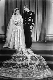 England was still an atmosphere of wartime austerity, and elizabeth had to use ration coupons from the government to obtain the satin with queen elizabeth ii has very famously been a dog lover from a young age. 10 Hidden Details You Didn T Know About Queen Elizabeth S Wedding Dress Queen Elizabeth Ii S Bridal Gown