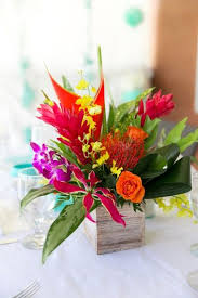 Tropical Wedding Centerpiece Idea Bright Colored Centerpiece With Proteas Roses O Tropical Wedding Centerpieces Flower Centerpieces Unique Wedding Flowers
