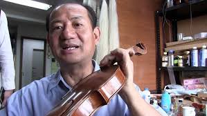 Wesley Baggett French Polishing a new violin.