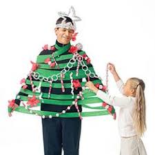 Don T Limit Your Tree Trimming Traditions To Your Evergreen Transform Dad Into A Decorated Christmas Tree Christmas Games Christmas Tree Game Kids Christmas