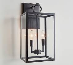 Candleplates hold eight tall and six short glass votives that accommodate metal cupped tea lights. Manor Glass Iron Sconce Pottery Barn