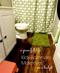 This girls bathroom has a colorful floral wallpaper that gives this space a lively feel. Girls Bath Re Do From Girly Girl To Big Girl A Grace Full Life
