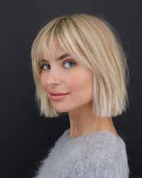 The short hair with bangs, the lush, dark brunette color or the superbly luxurious pearl earrings with the channel logo on them? 23 Short Hair With Bangs Hairstyle Ideas Photos Included