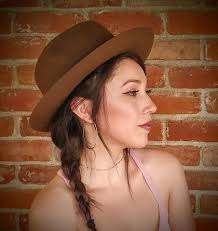 Dog Mitzi Lu wearing a funny hat