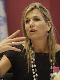 Queen Maxima of the Netherlands ducks from delivery man in India