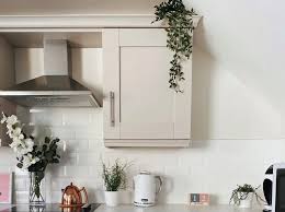 Just keep in mind that secret stashes should be as visible as their name implies…hidden and not seen. Is Greenery Above Kitchen Cabinets Outdated With Ideas For Modern Look