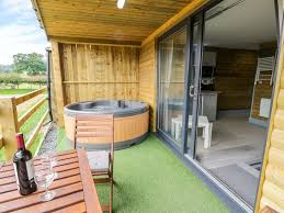 Hi spec luxury log cabins complete with a hot tub. Cilan Lodge Llandrillo Llechwedd Cilan Self Catering Holiday Cottage