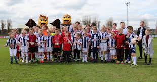 As well as a matchday programme featuring the child's photo and a commemorative disc with photography. Give Your Child A Vip Mascot Day With West Bromwich Albion Legends
