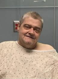 Can someone edit my deceased brother's photo to improve the background and  clothing?