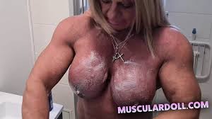 Professional Female Bodybuilder Put Cream on Her Nude Muscle Body