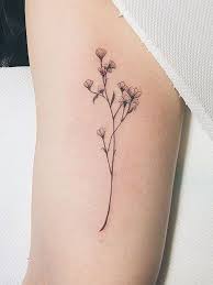 14 Delicate Flower Tattoos That Are Not Naff Flower Tattoo Designs Delicate Flower Tattoo Tattoos Tiny Tattoos