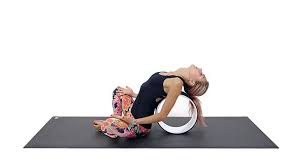Yoga Wheel Tutorial Here Are 5 Ways To Use A Yoga Wheel Photos Yoga Wheel Wheel Pose Yoga Yoga Props
