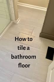 How To Tile A Bathroom Floor Bathroom Flooring Tile Floor Diy Flooring