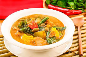 Garang asem, chicken dish cooked using banana leaves and dominated by sour and spicy flavor. Lowellatheists