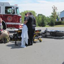 Motorcycle, truck collide