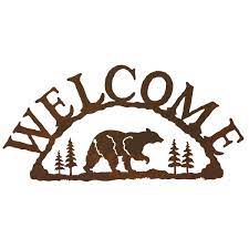 It has holes punched in the top center and bottom center for hanging purposes. Bear Metal Art Welcome Sign