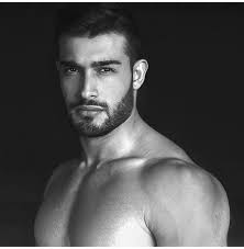 His sister took him to her close friend michael costello who is a fashion designer. Sam Asghari