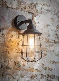 The Striking Caged Design Of The Finsbury Wall Light Adds An Industrial Touch To Any Ou Industrial Outdoor Lighting Garden Wall Lights Vintage Outdoor Lighting