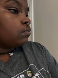 I'm thinking about an anti eyebrow piercing with what I think is called a  surface Anchor? It looks like a staple basically. Can I see pictures of  yours? And pictures of scars